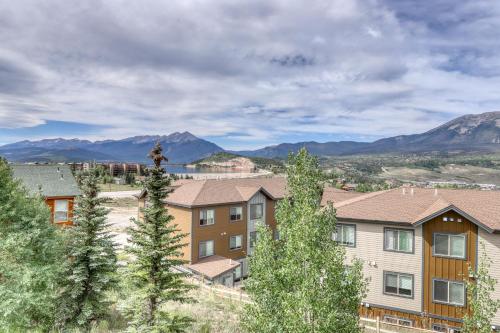 a person is standing on top of some houses at Lookout Ridge 63 in Dillon