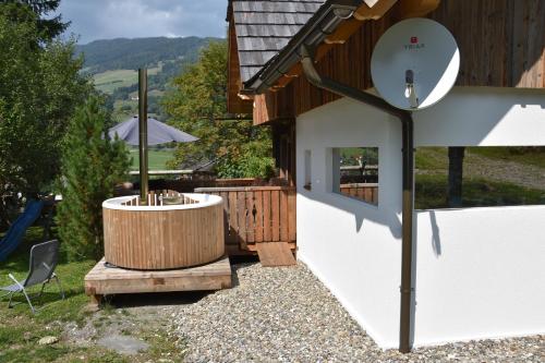 a hot tub sitting next to a building at Apartment Krobath in Murau