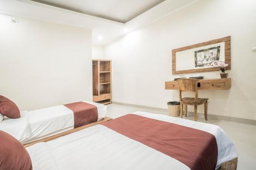 Postel nebo postele na pokoji v ubytování Sriwedari 40 Ubud
