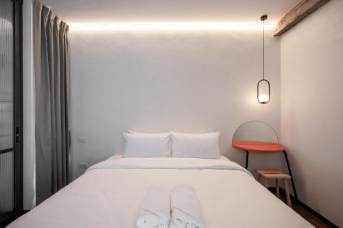 Ένα ή περισσότερα κρεβάτια σε δωμάτιο στο Wonderwall Hotel