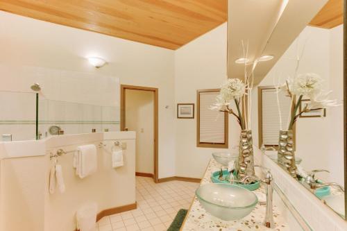 a bathroom with a sink and a mirror at Haystack Views Vacation Rental in Cannon Beach