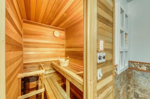 a sauna with wood paneling and a window at Home Away from Home + Studio in North Hero