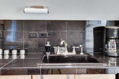 a kitchen counter with a sink in a kitchen at Cabin in the Woods in Cabin Creek