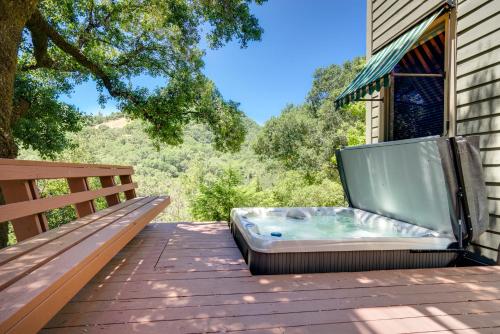 a hot tub on the deck of a house at Leslie Creek House in Mark West Springs