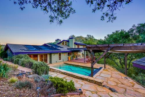 an exterior view of a house with a swimming pool at Leslie Creek House in Mark West Springs