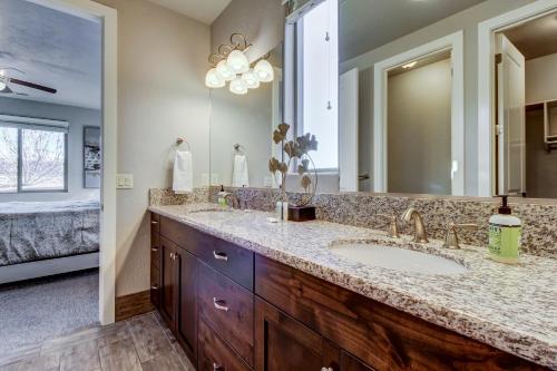 a bathroom with a sink and a large mirror at Private Pool Retreat: Paradise Village #17 in Santa Clara