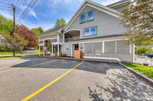 an empty parking lot in front of a house at Cozy Stowe Retreat in Stowe