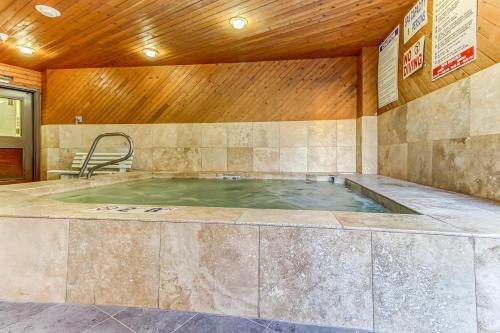 a hot tub in a room with a wooden ceiling at Park City Getaway in Park City