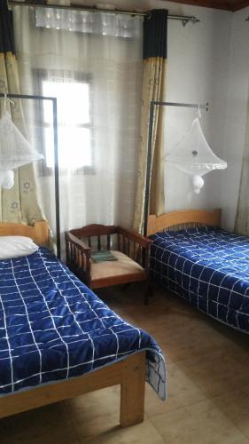מיטה או מיטות בחדר ב-Victoria Panorama Hotel