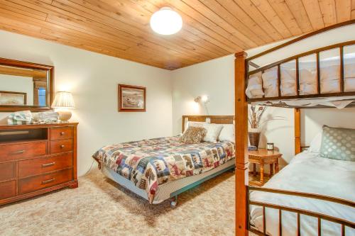 a bedroom with a bunk bed and a dresser at Bay Point Lakefront 4A Down in Whitefish