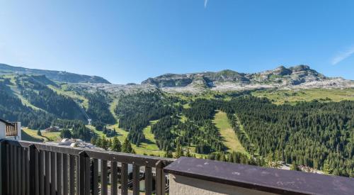 a view of the mountains from a balcony at Résidence Pierre & Vacances La Forêt in Flaine