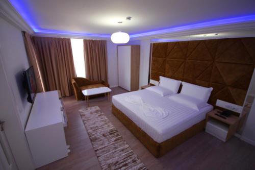 מיטה או מיטות בחדר ב-ELJOS HOTEL
