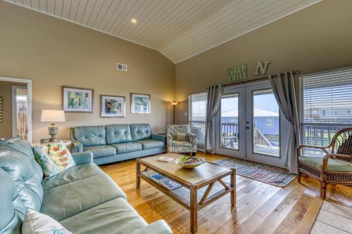 a living room with a couch and a table at Just Chillin' in Dauphin Island