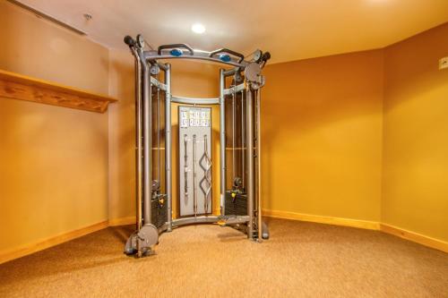 a room with a door in a house with yellow walls at Passage Point 422 in Copper Mountain