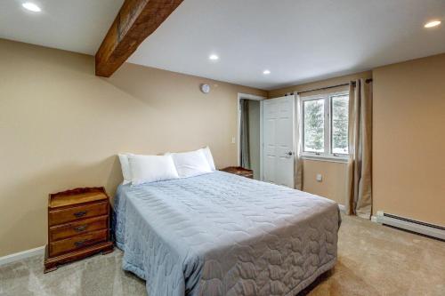 a bedroom with a large bed and a window at Alpine Drive Adventure in Telemark Village
