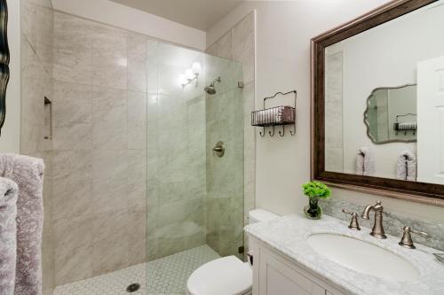 a bathroom with a shower and a sink and a mirror at Jarvis #301 in Durango