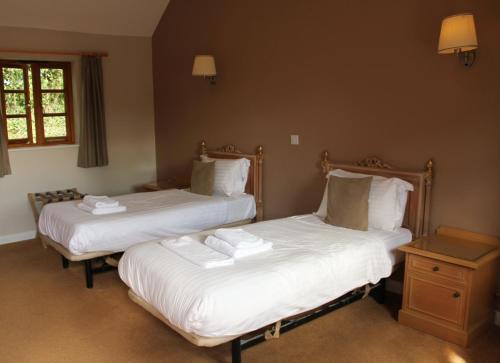 A bed or beds in a room at The Ancient Mariner 