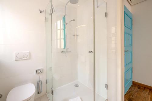 a bathroom with a shower and a toilet at Piccolo Grand Hotel in Pizzo