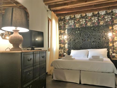 Letto o letti in una camera di Rigoletto Charm