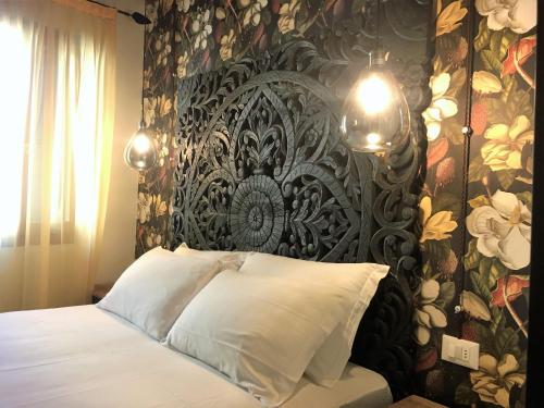 Letto o letti in una camera di Rigoletto Charm