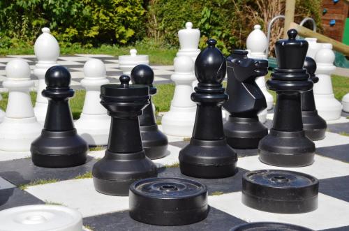 a large chess board with black and white chess pieces at Luccombe Hall Hotel in Shanklin