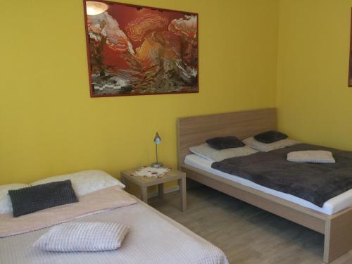 Кровать или кровати в номере Apartment Praha 4