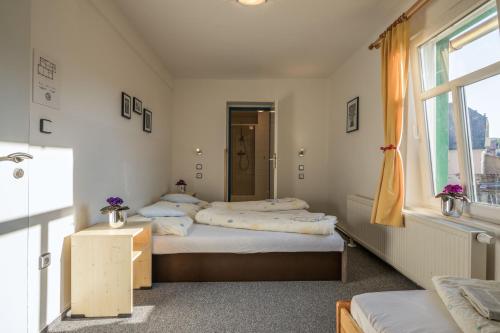 Postel nebo postele na pokoji v ubytování Penzion Slunečnice
