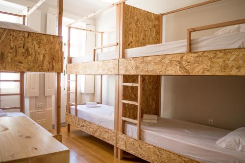 Ένα ή περισσότερα κρεβάτια σε δωμάτιο στο Queen's Garden Hostel