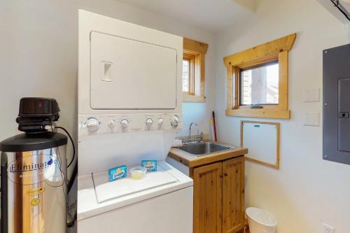 a small kitchen with a sink and a sink at Coyote Run 12 in Moab