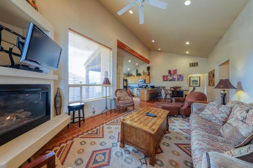 a living room with a couch and a fireplace at Rim Village O3 in Moab