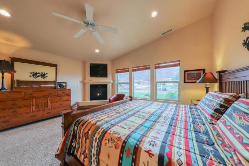 a bedroom with a bed and a ceiling fan at Rim Village O3 in Moab