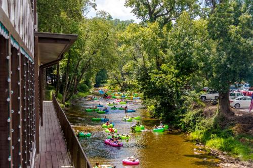 a group of people kayaking down a river at Laurel Creek in Helen