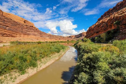 a river in the middle of a canyon at Rim Village M4 in Moab