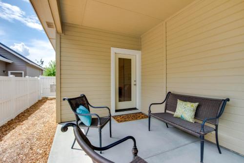 a patio with two chairs and a bench on a house at Sunglow Townhouse in Boise