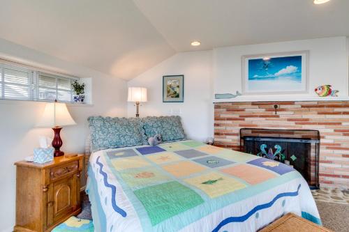 a bedroom with a bed and a fireplace at Hale Kaalawai Unit A in Oceanside