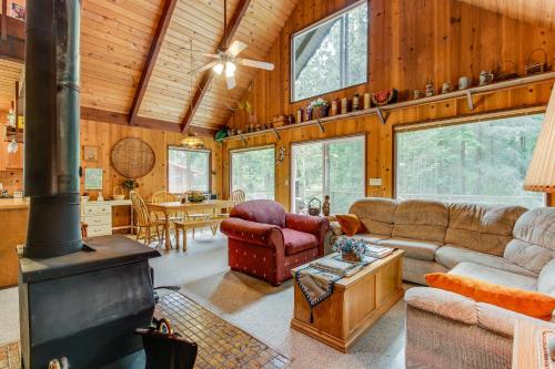 a living room with a fireplace in a house at The Chalet on Lopez in Islandale