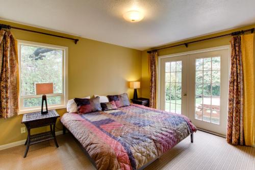 a bedroom with a bed and a large window at Jumping Scallops in Newport