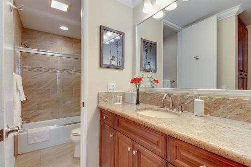 a bathroom with a sink and a shower at North Coast Village Retreat in Oceanside