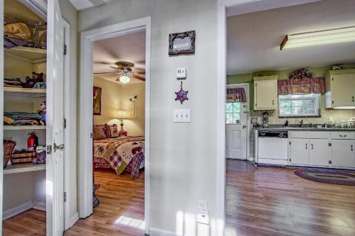 a kitchen and living room with a bed in the background at Bearadise in Ellijay