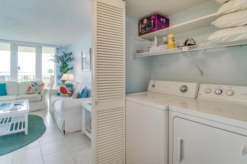 a kitchen and living room with a washer and dryer at Dunes on the Bay in Pensacola Beach