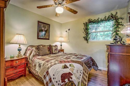 a bedroom with a bed and a ceiling fan at Bearadise in Ellijay
