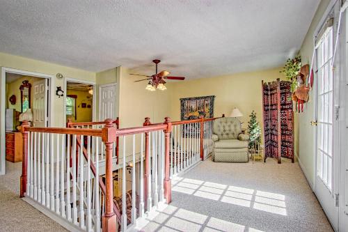a room with a staircase with a ceiling fan at Bearadise in Ellijay