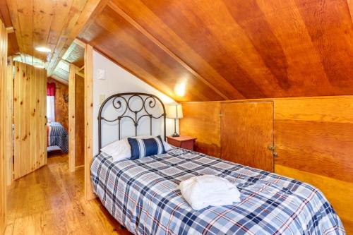 a bedroom with a bed with a wooden ceiling at Still Meadows in McComas Beach