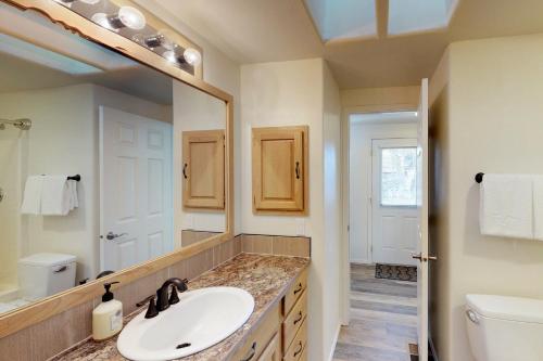 a bathroom with a sink and a mirror at Manson Lake House in Manson