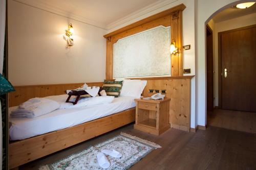 Кровать или кровати в номере Hotel Chalet all'Imperatore