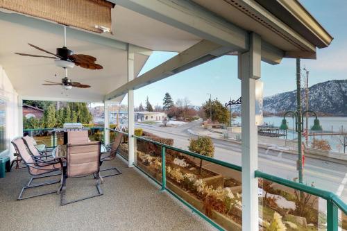 a balcony with chairs and a view of a river at Manson Lake House in Manson