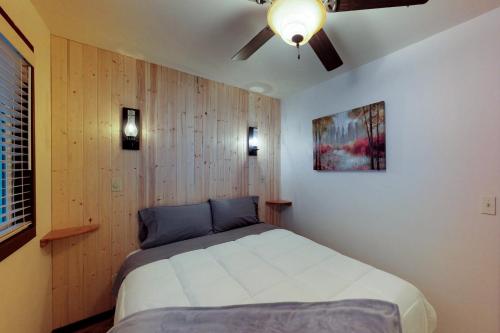a bedroom with a bed and a ceiling fan at Plain Getaway in Chumstick