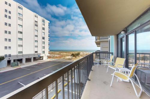 a balcony with chairs and a view of the ocean at Braemar Towers 209 in Ocean City