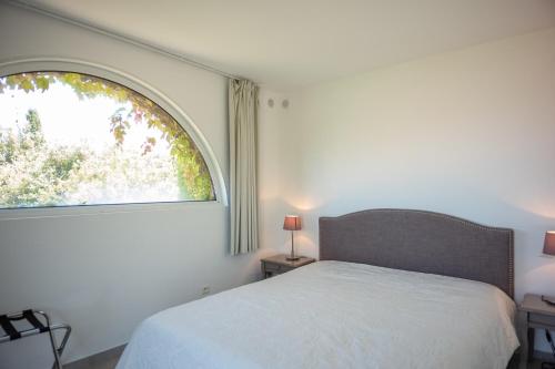 Кровать или кровати в номере La Citadelle Appartements