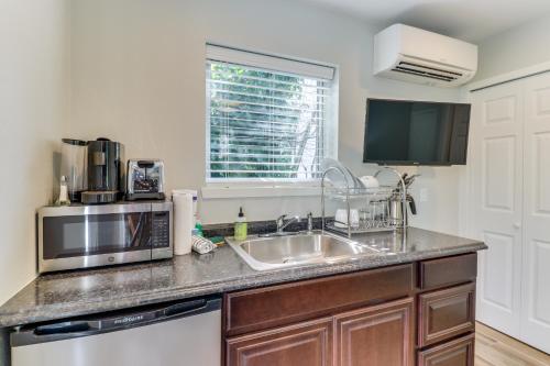a kitchen with a sink and a microwave at Mercer Island- Mt Saint Helens Room in Mercer Island